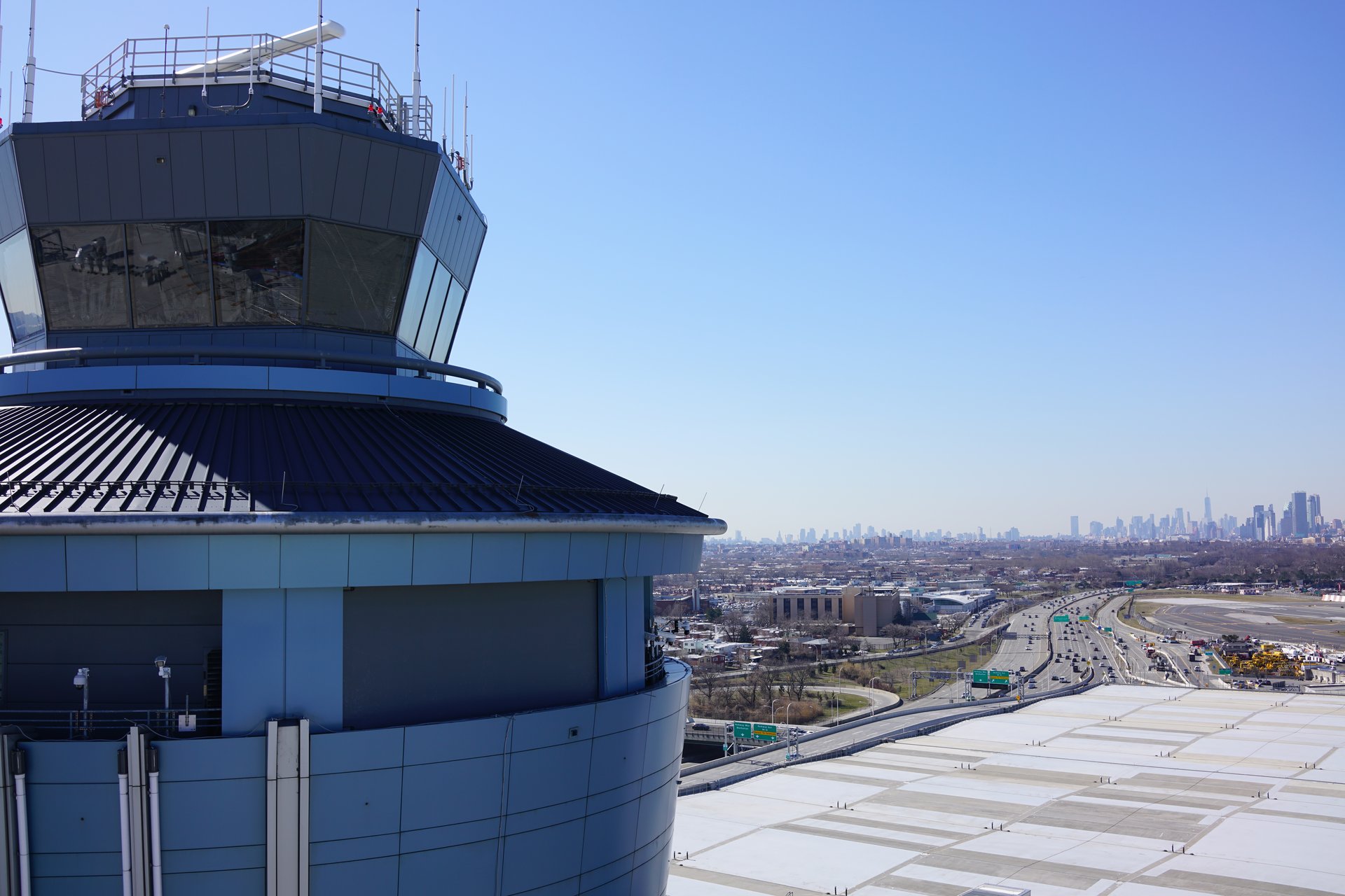 Drone view of LaGuardia Airport control tower with NYC skyline
